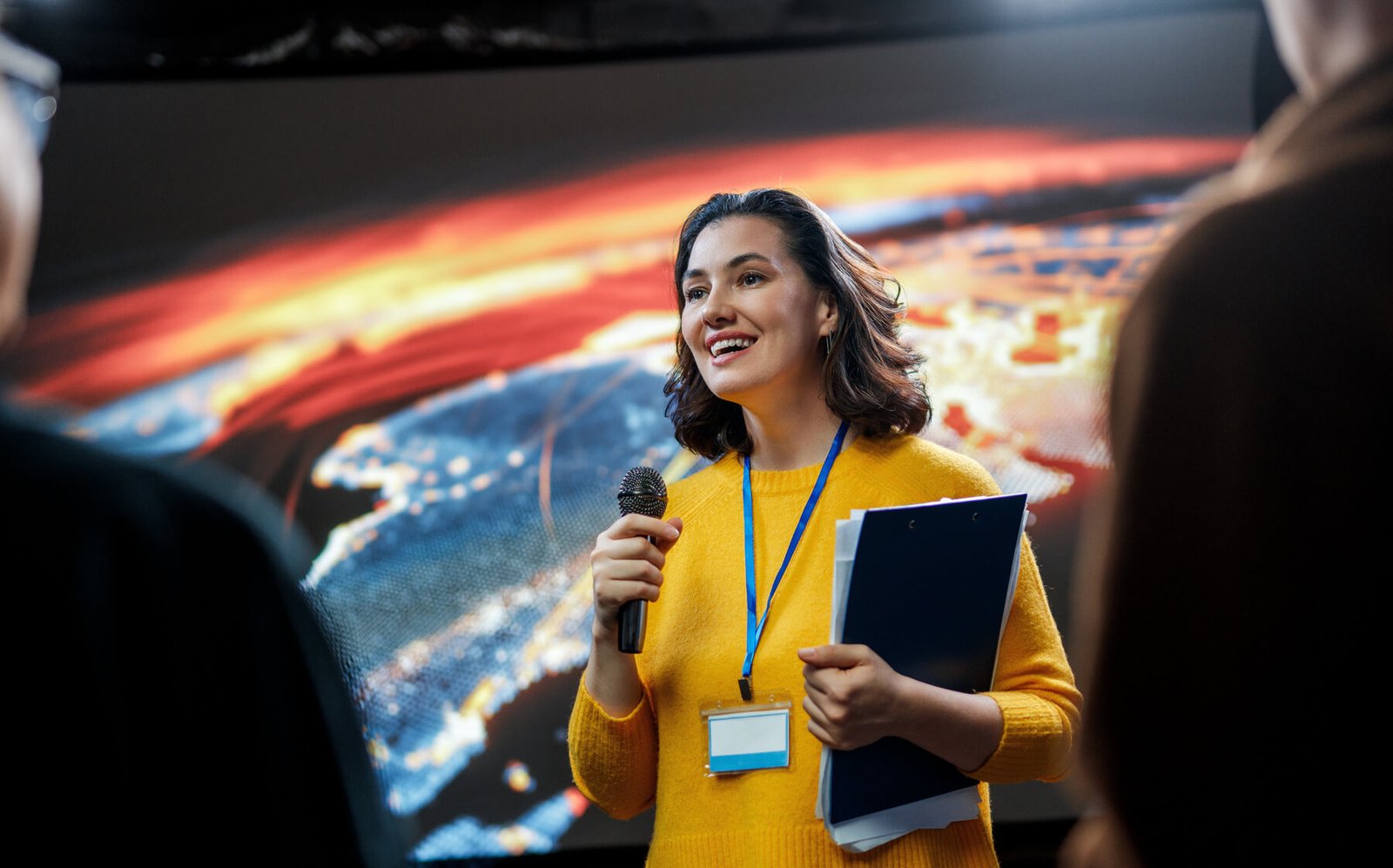 Woman is giving a presentation at conference utc
