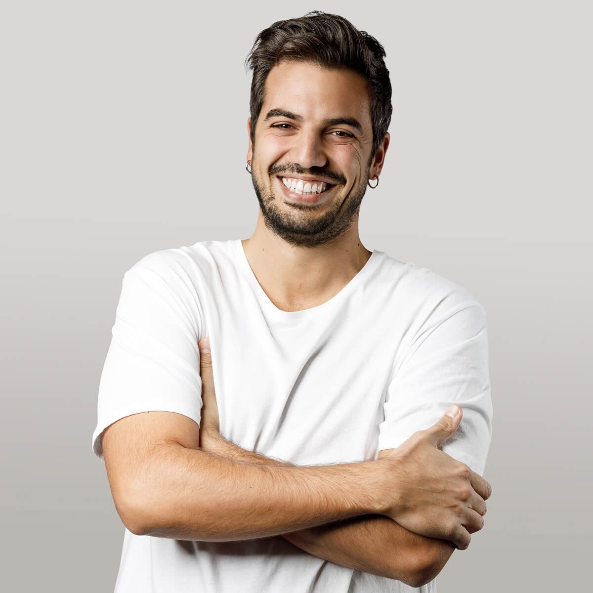 Cheerful young beard man looking at camera